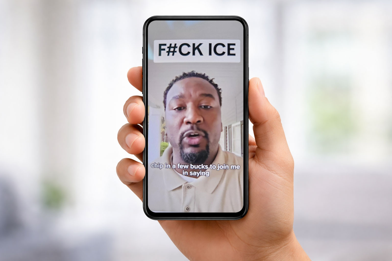Image of Jermaine Johnson on a cell phone